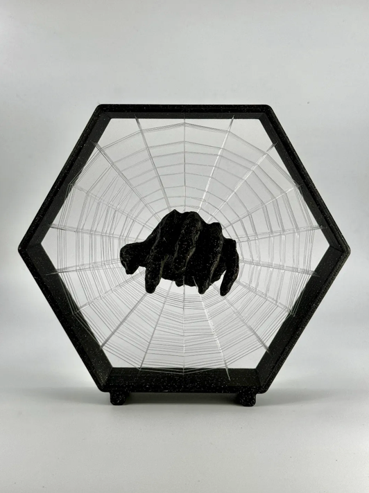 Monster hand in cobweb string art